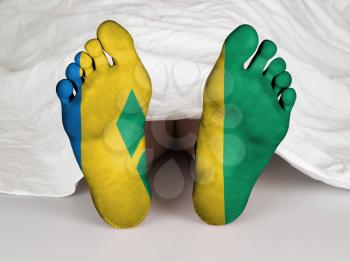 Feet with flag, sleeping or death concept, flag of Saint Vincent and the Grenadines