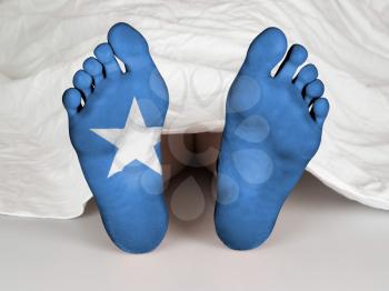 Feet with flag, sleeping or death concept, flag of Somalia