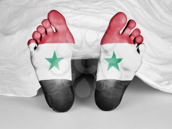 Dead body under a white sheet, flag of Syria