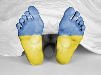 Dead body under a white sheet, flag of Ukraine
