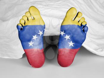 Dead body under a white sheet, flag of Venezuela