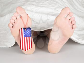 USA flag tag on the foot of a body