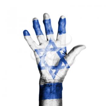 Hand of an old woman, wrapped with a pattern of the flag of Israel, isolated on white
