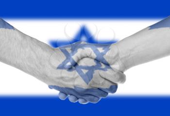 Man and woman shaking hands, arms wrapped in the flag of Israel