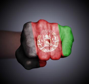 Front view of punching fist on gray background, flag of Afghanistan