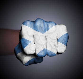 Front view of punching fist, banner of Scotland