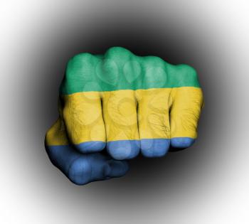 Fist of a man punching, flag of Gabon