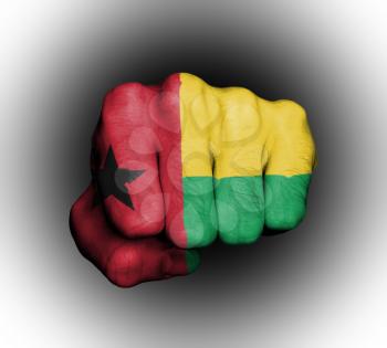 Fist of a man punching, flag of Guinea-Bissau