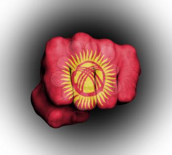 Fist of a man punching, flag of Kyrgyzstan