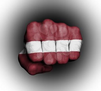 Fist of a man punching, flag of Latvia