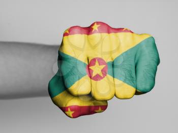 Fist of a man punching, flag of Grenada