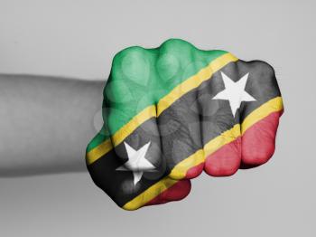 Fist of a man punching, flag of Saint Kitts and Nevis