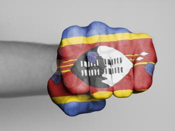 Fist of a man punching, flag of Swaziland