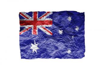Close up of a curled paper on white background, print of the flag of Australia
