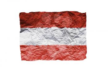 Close up of a curled paper on white background, print of the flag of Austria