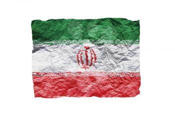 Close up of a curled paper on white background, print of the flag of Iran