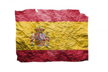Close up of a curled paper on white background, print of the flag of Spain