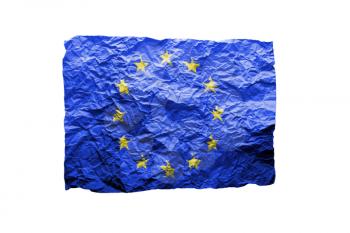 Close up of a curled paper on white background, print of the flag of the European Union
