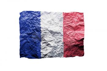 Close up of a curled paper on white background, print of the flag of France