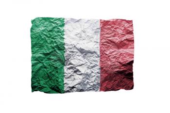 Close up of a curled paper on white background, print of the flag of Italy