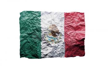 Close up of a curled paper on white background, print of the flag of Mexico