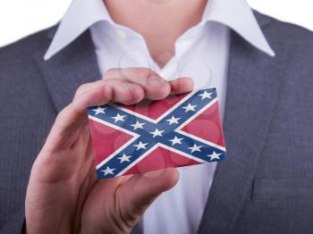 Businessman showing card, matte paper effect, Battle flag of the US Confederacy