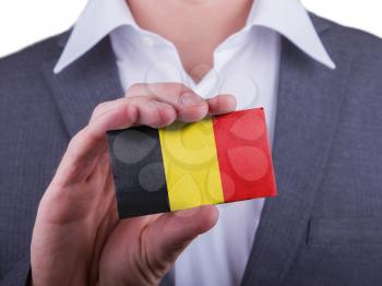 Businessman showing card, matte paper effect, Belgium