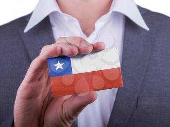 Businessman showing card, matte paper effect, Chile