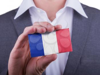 Businessman showing card, matte paper effect, France