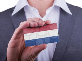 Businessman showing card, matte paper effect, Netherlands