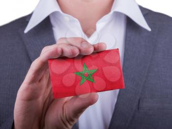 Businessman showing card, matte paper effect, Morocco
