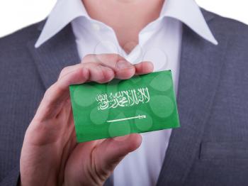 Businessman showing card, matte paper effect, Saudi Arabia