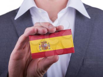 Businessman showing card, matte paper effect, Spain