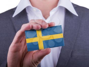 Businessman showing card, matte paper effect, Sweden