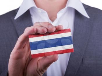 Businessman showing card, matte paper effect, Thailand