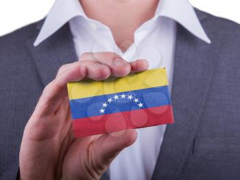 Businessman showing card, matte paper effect, Venezuela