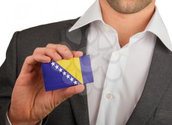 Businessman is holding a business card, flag of Bosnia and Herzegovina