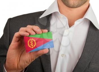 Businessman is holding a business card, flag of Eritrea