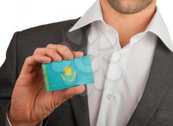 Businessman is holding a business card, flag of Kazakhstan