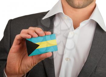 Businessman is holding a business card, flag of The Bahamas