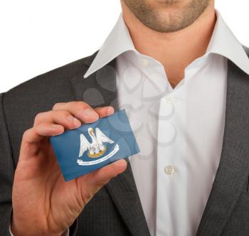 Businessman is holding a business card, flag of Louisiana