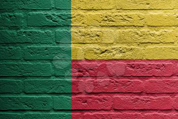 Brick wall with a painting of a flag isolated, Benin