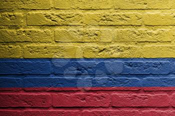 Brick wall with a painting of a flag isolated, Colombia