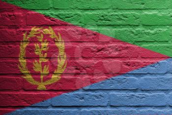 Brick wall with a painting of a flag isolated, Eritrea