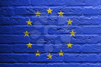 Brick wall with a painting of a flag isolated, EU