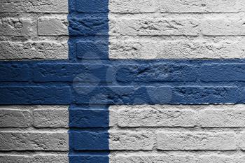Brick wall with a painting of a flag isolated, Finland