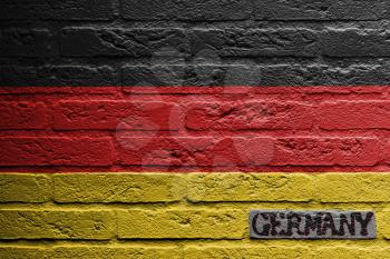 Brick wall with a painting of a flag isolated, Germany
