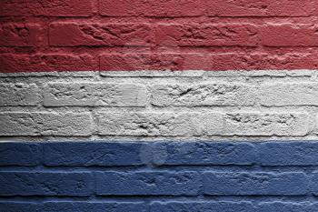 Brick wall with a painting of a flag isolated, Holland