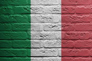 Brick wall with a painting of a flag isolated, Italy