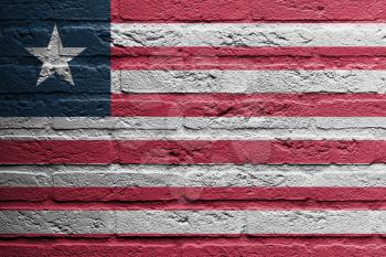 Brick wall with a painting of a flag isolated, Liberia